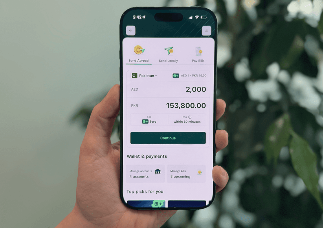Hand holding an iPhone showcasing the remittance feature within the Careem App